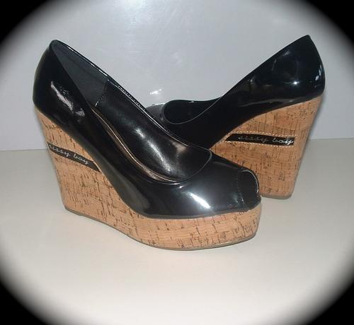 Size 7 New ladies black patent style wedge cork heels.
